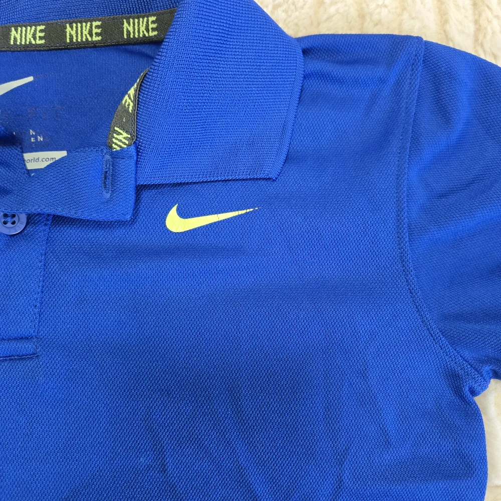 Nike DriFit Kids Medium Polo Shirt in Vibrant Blue W Volt Yellow Logo